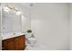 Bright bathroom featuring a toilet, vanity, and tiled floor at 1009 Bentham Dr, Raleigh, NC 27614