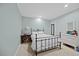 Bright bedroom featuring a full-sized bed, natural light, and neutral decor at 1009 Bentham Dr, Raleigh, NC 27614