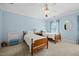 Charming bedroom featuring blue walls, plush carpet, and two twin beds with vintage accents at 1009 Bentham Dr, Raleigh, NC 27614