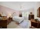Inviting bedroom features soft colors, with natural light, plush carpet, and wood furniture at 1009 Bentham Dr, Raleigh, NC 27614