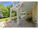 Inviting covered patio with ceiling fan, outdoor seating, and steps leading to the upper deck at 1009 Bentham Dr, Raleigh, NC 27614