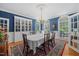 Elegant dining room featuring custom built-ins, a chandelier, and wainscoting at 1009 Bentham Dr, Raleigh, NC 27614