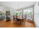 Dining room boasting hardwood floors, natural light, and a classic chandelier at 1009 Bentham Dr, Raleigh, NC 27614