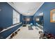 Home gym with fitness equipment, weights, and a mirror at 1009 Bentham Dr, Raleigh, NC 27614