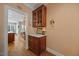 Hallway with striped wallpaper and wooden floor at 1009 Bentham Dr, Raleigh, NC 27614