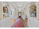 Elegant hallway with hardwood floors and decorative molding at 1009 Bentham Dr, Raleigh, NC 27614