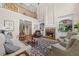 Elegant living room features soaring ceilings, fireplace, and large windows, creating a bright and inviting space at 1009 Bentham Dr, Raleigh, NC 27614