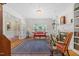 Cozy living room with fireplace, custom shelving, and large windows at 1009 Bentham Dr, Raleigh, NC 27614