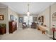Bright sitting room with armchairs, artwork, and natural light at 1009 Bentham Dr, Raleigh, NC 27614