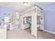 Unique bedroom with loft bed, built-in desk, and soft purple walls at 1054 Contender Dr, Clayton, NC 27520