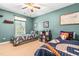 Shared ' bedroom with two beds, neutral carpet, and light blue-green walls at 1054 Contender Dr, Clayton, NC 27520