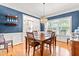 Cozy dining room featuring a chandelier, large windows, and access to other rooms for a functional entertaining space at 1054 Contender Dr, Clayton, NC 27520