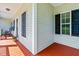 The front porch of this beautiful home has stylish columns and painted deck, with great curb appeal at 1054 Contender Dr, Clayton, NC 27520