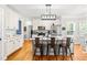 Charming eat-in kitchen features a center island, stainless appliances, and hardwood flooring at 1054 Contender Dr, Clayton, NC 27520