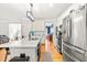 Modern eat-in kitchen featuring stainless appliances, subway tile backsplash, and hardwood flooring at 1054 Contender Dr, Clayton, NC 27520