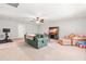 Expansive living area features comfortable sofas, a TV, and soft carpeting at 1054 Contender Dr, Clayton, NC 27520