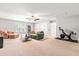 Spacious living room with plush seating, a ceiling fan, and a Peloton bike at 1054 Contender Dr, Clayton, NC 27520