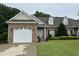 Charming brick home with a well-manicured lawn, attached garage and lovely landscaping at 108 Calloway Road Rd, Rocky Mount, NC 27804
