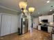 Open kitchen features stainless steel appliances, white cabinets, and hardwood floors at 108 Calloway Road Rd, Rocky Mount, NC 27804