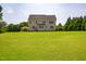 Expansive backyard featuring a well-maintained lawn, offering ample space for recreation at 109 Lake Point Dr, Clayton, NC 27527