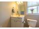 Cozy bathroom featuring a vanity, mirror, and toilet at 109 Lake Point Dr, Clayton, NC 27527