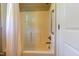 Clean bathroom featuring a white shower and safety grab bar at 109 Lake Point Dr, Clayton, NC 27527