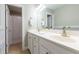 Bright bathroom featuring a double vanity, neutral paint, and a shower with a curtain at 109 Lake Point Dr, Clayton, NC 27527