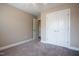 Bedroom with plush carpeting, neutral walls, closet, and ensuite access at 109 Lake Point Dr, Clayton, NC 27527