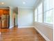 Bright breakfast nook with hardwood flooring and natural light streaming through large windows at 109 Lake Point Dr, Clayton, NC 27527