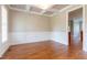 Classic dining room featuring wainscoting, hardwood floors, and coffered ceilings at 109 Lake Point Dr, Clayton, NC 27527