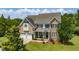 Beautiful two-story brick home with a two-car garage and manicured lawn at 109 Lake Point Dr, Clayton, NC 27527