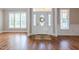Inviting entryway with a decorative front door and large windows for natural light at 109 Lake Point Dr, Clayton, NC 27527