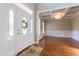 Elegant entrance with a decorative glass front door, high ceilings and beautiful light fixture at 109 Lake Point Dr, Clayton, NC 27527