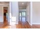 Bright foyer featuring hardwood floors and views into multiple rooms at 109 Lake Point Dr, Clayton, NC 27527
