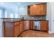 Spacious kitchen with stainless steel appliances, wooden cabinets and tile backsplash at 109 Lake Point Dr, Clayton, NC 27527
