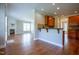 Bright open-concept living room featuring hardwood floors, fireplace, and seamless flow to the kitchen at 109 Lake Point Dr, Clayton, NC 27527