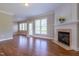Bright living room showcasing a fireplace with decorative trim and natural light at 109 Lake Point Dr, Clayton, NC 27527