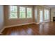 Spacious living room with hardwood flooring and many windows at 109 Lake Point Dr, Clayton, NC 27527