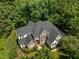 Stunning aerial view of a well-maintained home surrounded by lush foliage, highlighting its privacy at 109 San Juan Dr, Chapel Hill, NC 27514