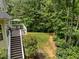 Spacious wooden deck with outdoor seating, perfect for entertaining, overlooks the serene, wooded backyard at 109 San Juan Dr, Chapel Hill, NC 27514