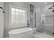 A spa-like bathroom featuring a soaking tub, shower and modern finishes offering a tranquil retreat at 109 San Juan Dr, Chapel Hill, NC 27514