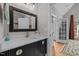 Bathroom featuring a stylish vanity with a marble countertop and a modern mirror at 109 San Juan Dr, Chapel Hill, NC 27514
