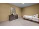 Finished bedroom features a dresser, art, and neutral carpet at 109 San Juan Dr, Chapel Hill, NC 27514