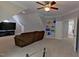 Bonus room featuring a comfy sofa, TV, bookshelf, and a doorway leading to other spaces at 109 San Juan Dr, Chapel Hill, NC 27514