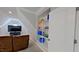 Bright bonus room features a built-in bookcase, television, and cozy seating at 109 San Juan Dr, Chapel Hill, NC 27514