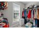 Bright closet with ample storage space, clothing rack, shelf, and a view of nature outside the window at 109 San Juan Dr, Chapel Hill, NC 27514