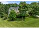 Exterior of house surrounded by large yard and mature trees at 109 San Juan Dr, Chapel Hill, NC 27514