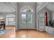 Inviting foyer with hardwood floors, arched doorways, and natural light creating a warm welcome at 109 San Juan Dr, Chapel Hill, NC 27514