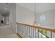 Hallway with a chandelier and a decorative window provides a lovely transition between rooms at 109 San Juan Dr, Chapel Hill, NC 27514