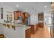 Spacious kitchen with granite countertops, custom cabinets, stainless appliances, and island sink at 109 San Juan Dr, Chapel Hill, NC 27514